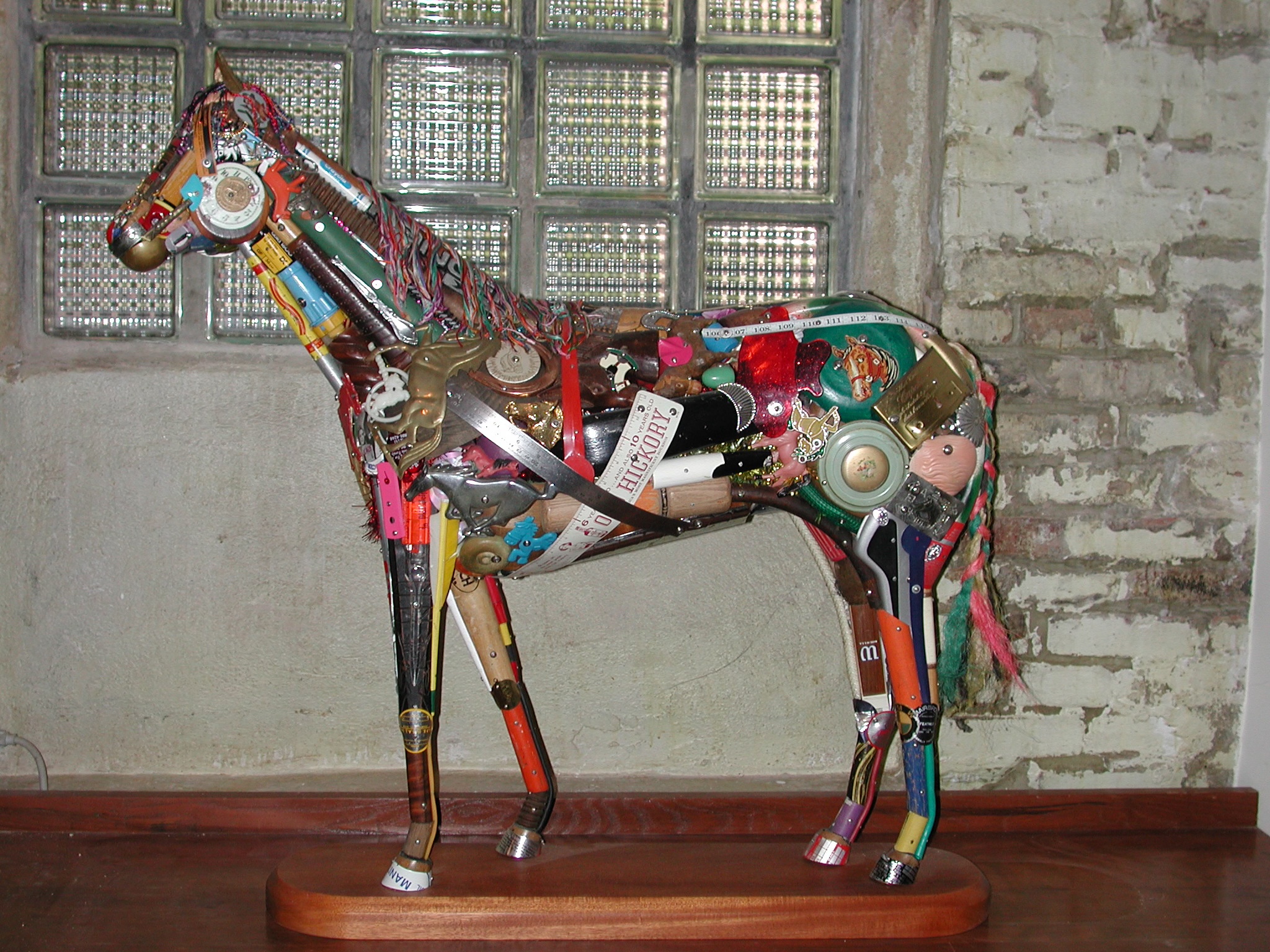 An assemblage sculpture built from salvaged metal, wood, and plastic objects by Philadelphia artist Leo Sewell